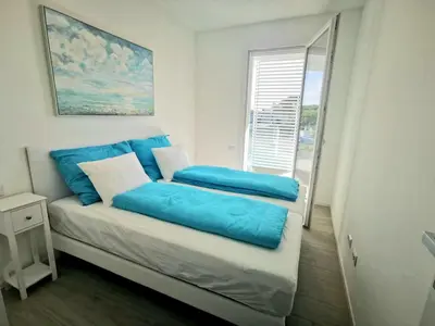 Letto o letti in una camera di Jesolo Pineta Fronte Mare - Jl Blue Apartments C25