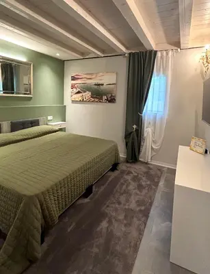 Letto o letti in una camera di Ca' Elisabetta, Romantic Suite