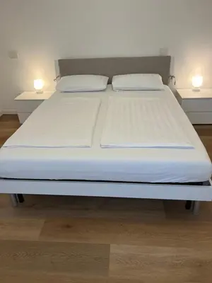 Letto o letti in una camera di Casa Inès