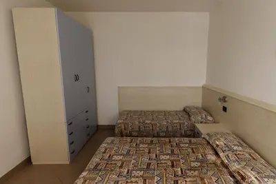 Letto o letti in una camera di Residence Vecchio Faro