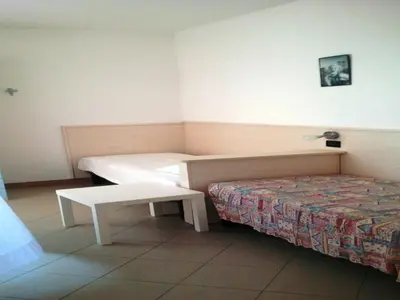 Letto o letti in una camera di Residence Vecchio Faro