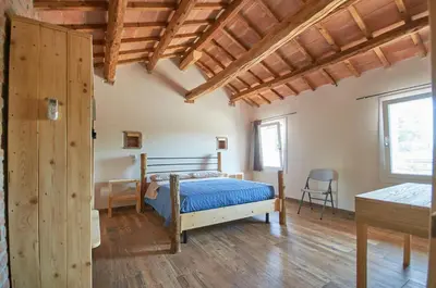 Letto o letti in una camera di Da Brussio