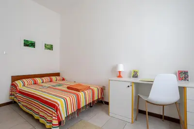 Letto o letti in una camera di A pochi passi dal mare Appartamento in centro