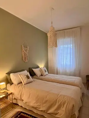 Letto o letti in una camera di Casa Lolò