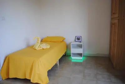 Letto o letti in una camera di Casa Amarilla Sacra Famiglia Padova
