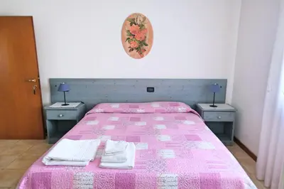Letto o letti in una camera di RosArancio