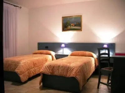 Letto o letti in una camera di RosArancio