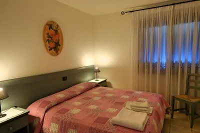 Letto o letti in una camera di RosArancio