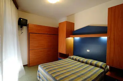Letto o letti in una camera di Hotel La Fenice