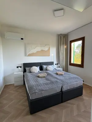 Letto o letti in una camera di Casa Cabini Piave
