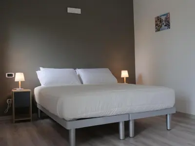 Letto o letti in una camera di Casa Villaggio Laguna