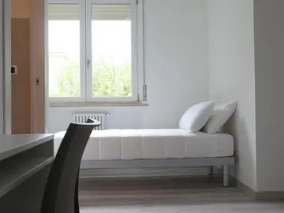 Letto o letti in una camera di Casa Villaggio Laguna