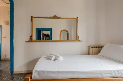 Letto o letti in una camera di GuestHost - Lido di Venezia - Two Aparments near the Beach