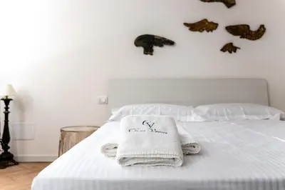 Letto o letti in una camera di Dimora Canal Fenice