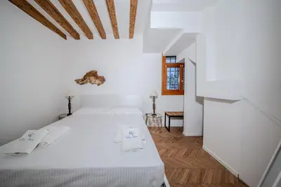 Letto o letti in una camera di Dimora Canal Fenice
