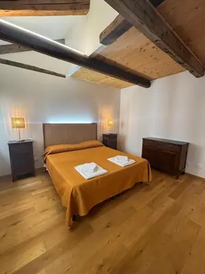 Letto o letti in una camera di Il giardino di Anna- appartamenti con giardino privato