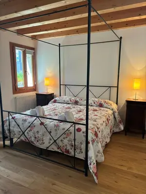 Letto o letti in una camera di Il giardino di Anna- appartamenti con giardino privato