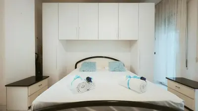 Letto o letti in una camera di Dimora Elisa by Ca-Sa Check