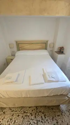 Letto o letti in una camera di Cà Dolce Vita