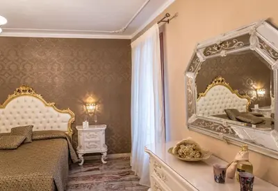 Letto o letti in una camera di Ca' del Cinema B&B