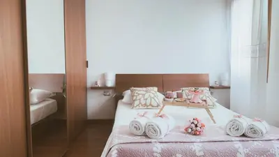 Letto o letti in una camera di Casa Andrea by Ca-Sa Check