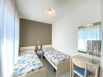Letto o letti in una camera di Artesi - Carraro Immobiliare - Family Apartments