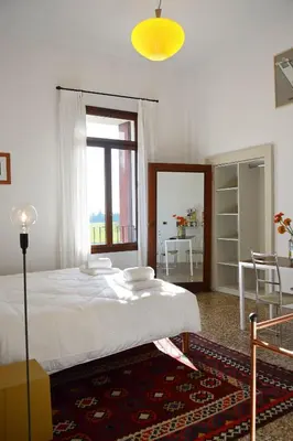 Letto o letti in una camera di B&B Giardino Jappelli (Villa Ca' Minotto)
