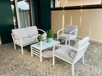 Area soggiorno di Golf Holiday House - Appartamento con soggiorno e due camere da letto