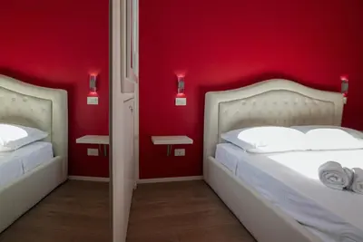 Letto o letti in una camera di Welc-ōM Domus Pedrocchi
