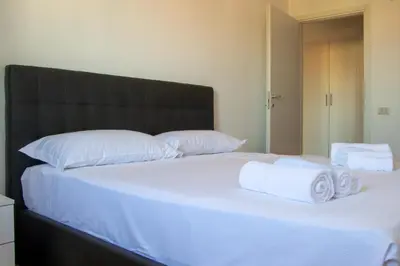 Letto o letti in una camera di Welc-ōM Toti Station Flat