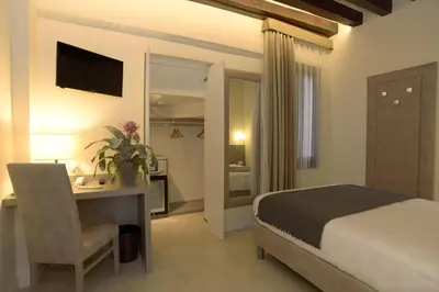 Letto o letti in una camera di Leone Hotel