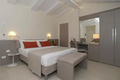 Letto o letti in una camera di Leone Hotel