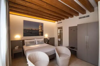 Letto o letti in una camera di Leone Hotel