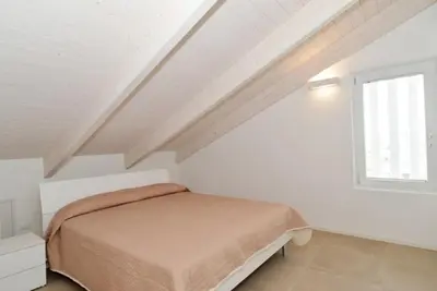 Letto o letti in una camera di Attico 6 posti letto Zona Piazza Aurora 280m dal mare