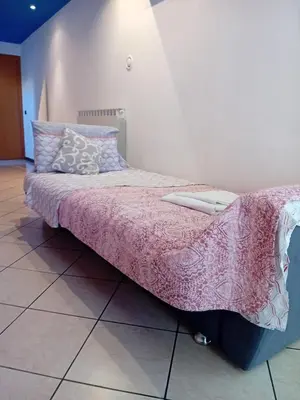 Letto o letti in una camera di Jolly Private Room