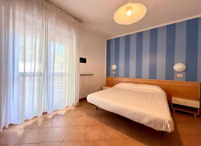 Letto o letti in una camera di Sole Mare - Carraro Immobiliare - Family Apartments