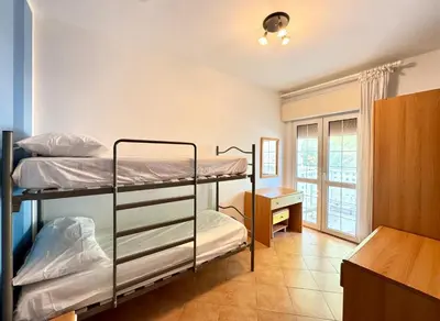 Letto o letti in una camera di Sole Mare - Carraro Immobiliare - Family Apartments