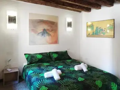 Letto o letti in una camera di Corte Regina Loft