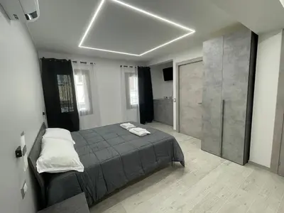 Letto o letti in una camera di Locazione turistica AL PORTO