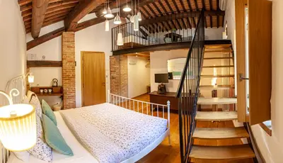 Letto o letti in una camera di Fattoria Le Vegre