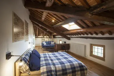 Letto o letti in una camera di Fattoria Le Vegre