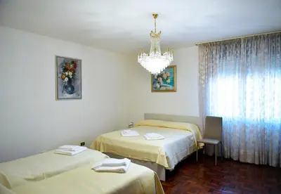 Letto o letti in una camera di Sole Abano Terme