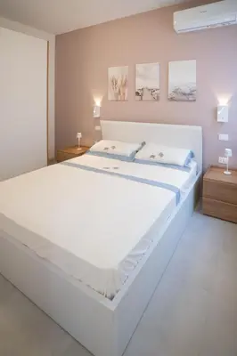 Letto o letti in una camera di Ca' Cesarino