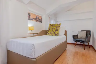 Letto o letti in una camera di Ca' Spadaria San Marco Family Apartment