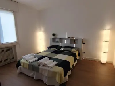 Letto o letti in una camera di Casa Domotica