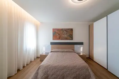 Letto o letti in una camera di EnJoy Home - Appartamento Cielo - Il Canterale