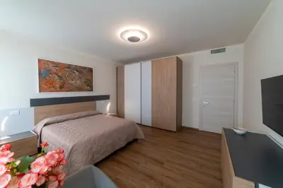 Letto o letti in una camera di EnJoy Home - Appartamento Cielo - Il Canterale