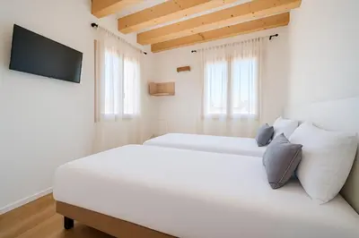 Letto o letti in una camera di Suite Mondrian e Suite Monet 100m dalla Biennale