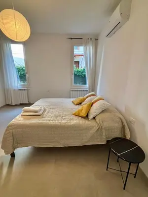 Letto o letti in una camera di Villa Vittoria Apartments