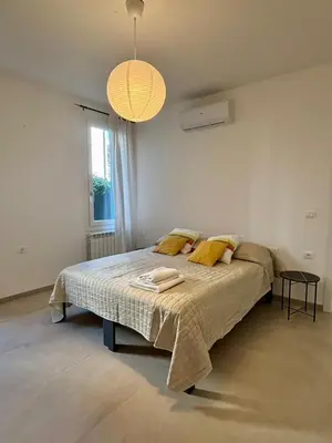 Letto o letti in una camera di Villa Vittoria Apartments